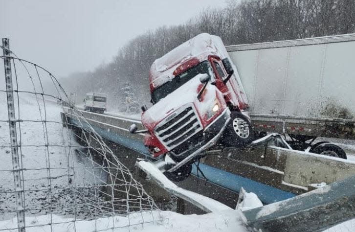 A jackknifed semi sent the rig's tractor over the bridge on southbound Interstate 65 about four miles south of the Dayton/Ind. 38 exit Wednesday just southeast of Lafayette. Scanner traffic indicated the driver was OK.