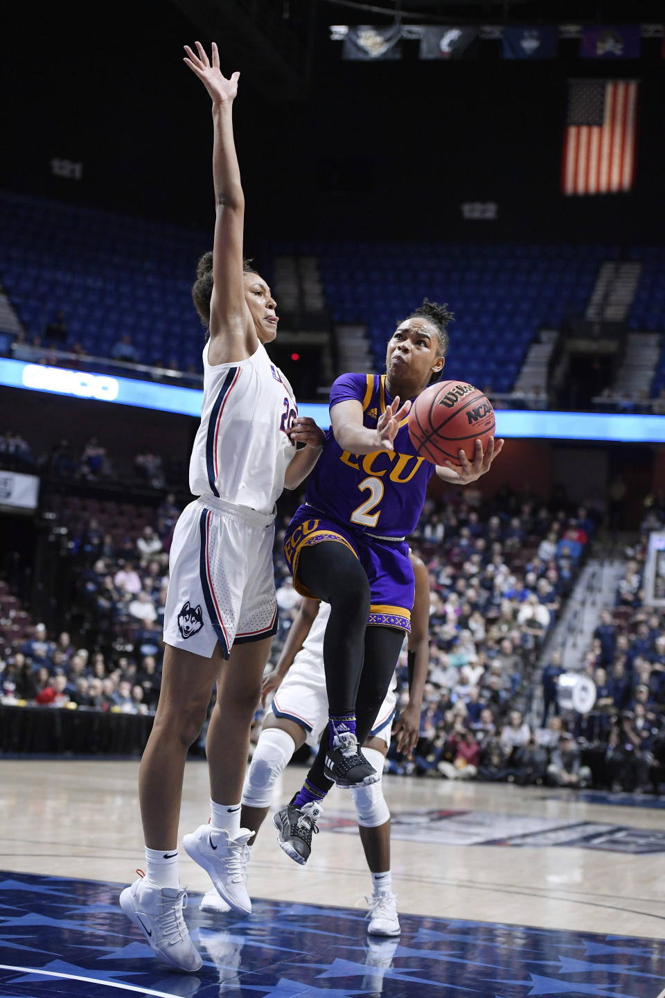 East Carolina's Lashonda Monk goes up to the basket as Connecticut's Olivia Nelson-Ododa defends during the second half of an NCAA college basketball game in the American Athletic Conference tournament quarterfinals, Saturday, March 9, 2019, at Mohegan Sun Arena in Uncasville, Conn. (AP Photo/Jessica Hill)
