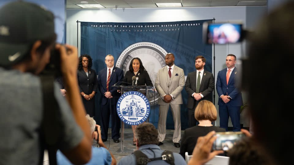 Fulton County District Attorney Fani Willis, flanked by Wade on her left, speaks at a news conference on August 14, 2023 in Atlanta, Georgia. - Megan Varner/Getty Images