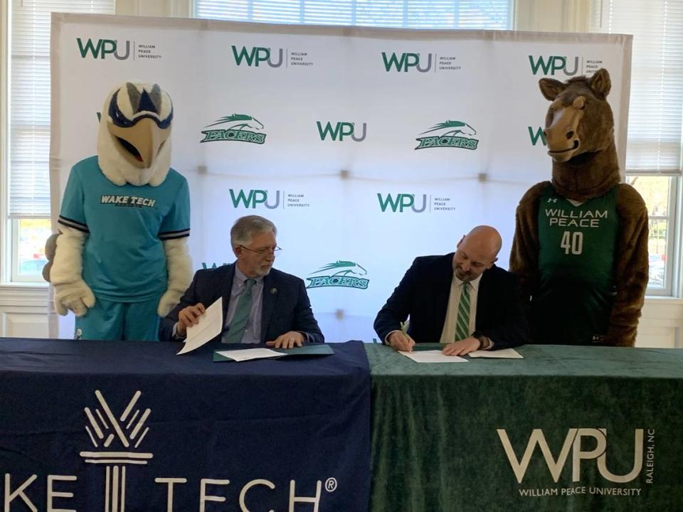 Dr. Scott Ralls, Wake Tech President, and Dr. Brian Ralph, William Peace President, sign new and revised articulation agreements between the schools.