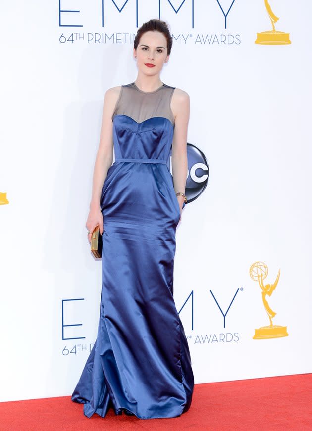 Don't recognize her without her corset? "Downton Abbey's" Michelle Dockery came decked out in a chic, cobalt blue Louis Vuitton dress with a sheer panel on top. The actress finished the modern look with a gold box clutch and bright red lips.