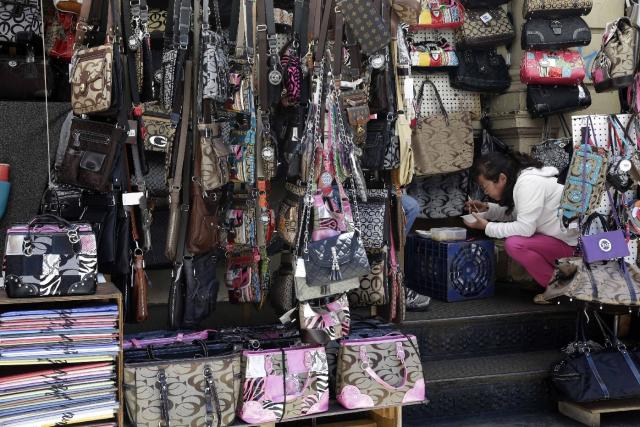 Vendors selling imitation designer bags on Canal Street in New York City.  Part 2 