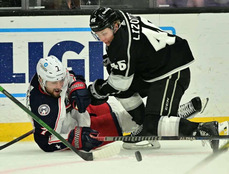 Apr 16, 2022; Los Angeles, California, USA;  Columbus Blue Jackets center Sean Kuraly (7) and Los Angeles Kings center Blake Lizotte (46) battle for the puck in the first period of the game at Crypto.com Arena. Mandatory Credit: Jayne Kamin-Oncea-USA TODAY Sports