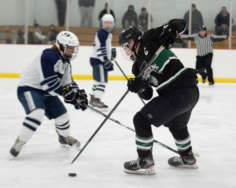 Aurora ice hockey takes on the Solon Comets at Gilmour Academy on Friday, January 21. Mike Mancine with possession.