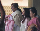 Proud grandfather Abhishek Bachchan with the new apple of his eye.