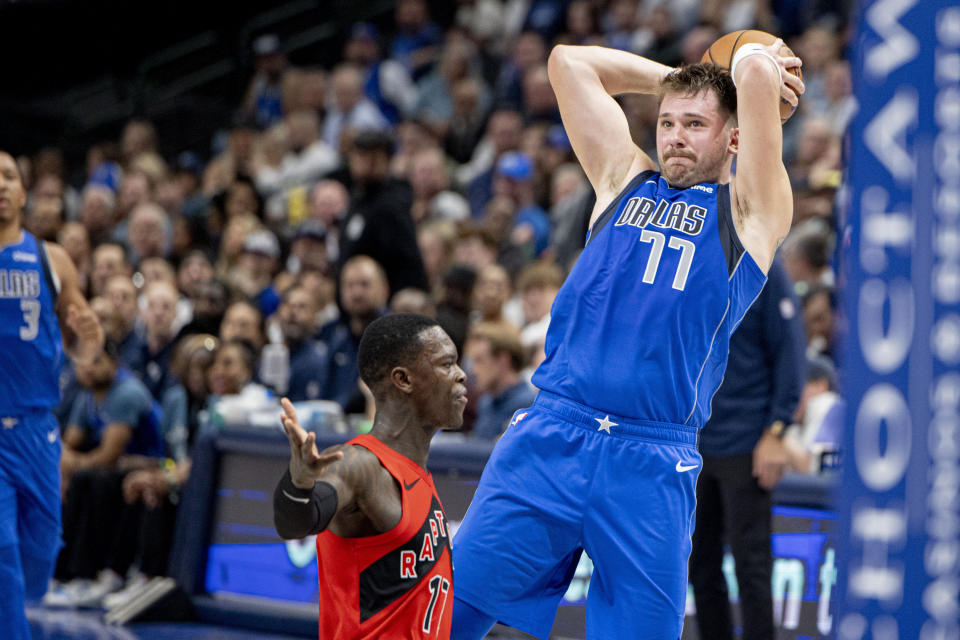 Dallas Mavericks guard Luka Doncic (77) looks to pass during the first half of an NBA basketball game against the Toronto Raptors, Wednesday, Nov. 8, 2023, in Dallas. (AP Photo/Gareth Patterson)