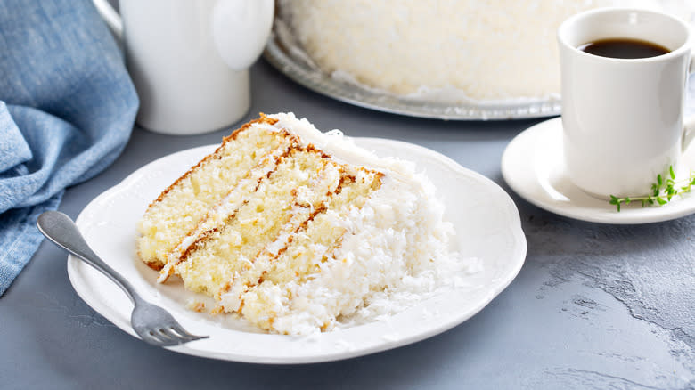 Coconut layer cake slice on a plate