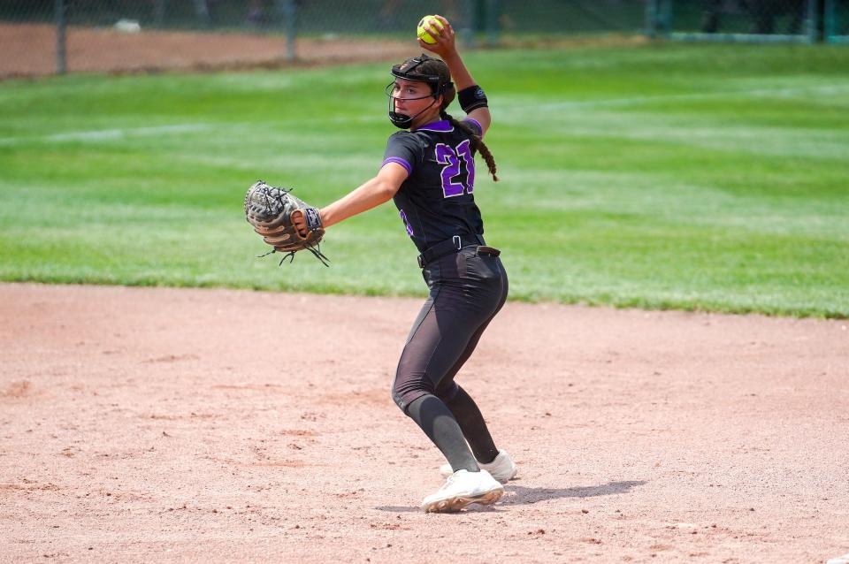Muscatine's Brylee Seaman (21) throws out a Waukee Northwest runner at first base during the Class 5A semifinals on Wednesday.