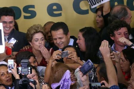 Brazil's President Dilma Rousseff is greeted by supporters after a signing ceremony for new universities at Planalto Palace in Brasilia, Brazil, May 9, 2016. REUTERS/Adriano Machado