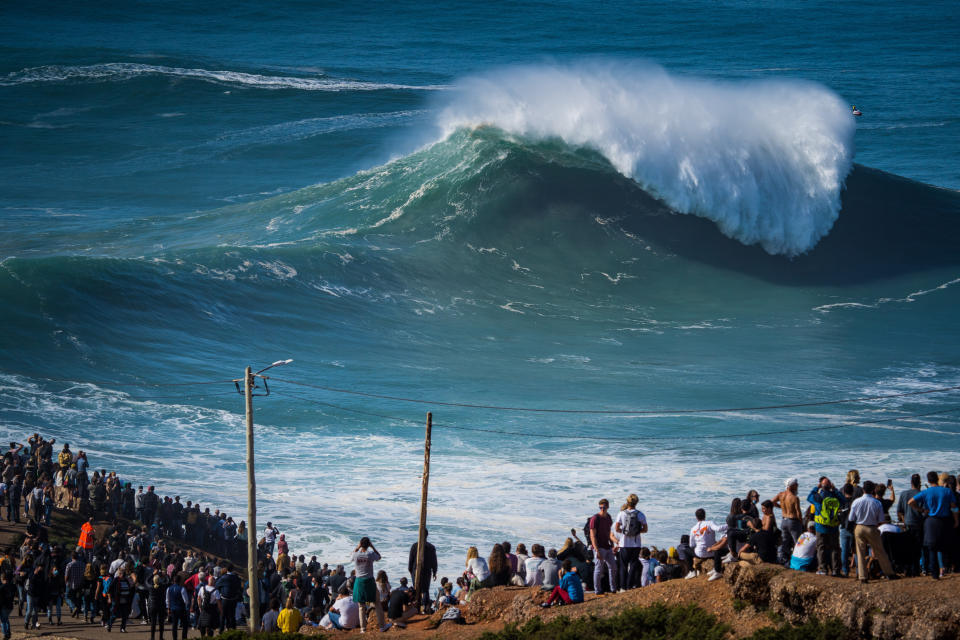 NAZARE, PORTUGAL - 2020/10/29: Despite the COVID-19 pandemic alert to social withdrawal, thousands of people attended the first big swell of the winter season in Praia do Norte. (Photo by Henrique Casinhas/SOPA Images/LightRocket via Getty Images)