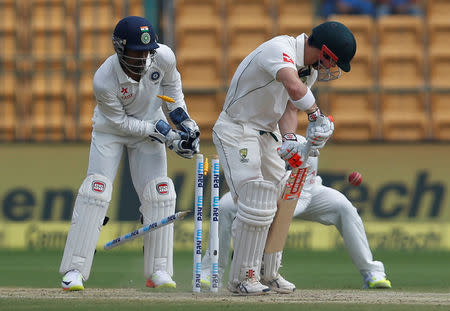 Cricket - India v Australia - Second Test cricket match - M Chinnaswamy Stadium, Bengaluru, India - 05/03/17. Australia's David Warner is bowled out by India's Ravichandran Ashwin. REUTERS/Danish Siddiqui