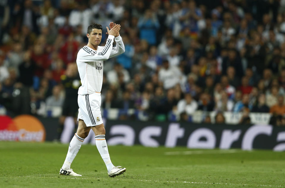 Real's Cristiano Ronaldo claps to his supporters as he leaves the pitch during a first leg semifinal Champions League soccer match between Real Madrid and Bayern Munich at the Santiago Bernabeu stadium in Madrid, Spain, Wednesday, April 23, 2014. (AP Photo/Andres Kudacki)