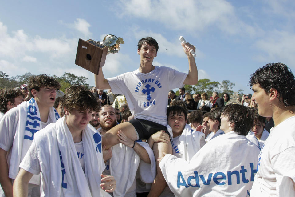 John Hittos, 16 celebrates after retrieving the cross during the 2024 Epiphany at Spring Bayou on Saturday, Jan. 6, 2024, in Tarpon Springs, Fla. (Luis Santana/Tampa Bay Times via AP)