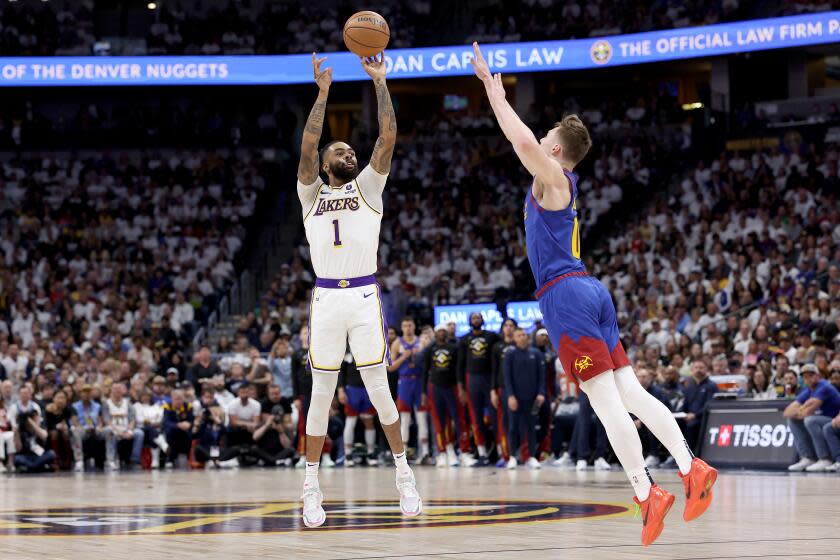 DENVER, COLORADO - APRIL 20: D'Angelo Russell #1 of the Los Angeles Lakers puts up a shot against Christian Braun #0 of the Denver Nuggets in the first quarter during game one of the Western Conference First Round Playoffs at Ball Arena on April 20, 2024 in Denver, Colorado. NOTE TO USER: User expressly acknowledges and agrees that, by downloading and or using this photograph, User is consenting to the terms and conditions of the Getty Images License Agreement. (Photo by Matthew Stockman/Getty Images)