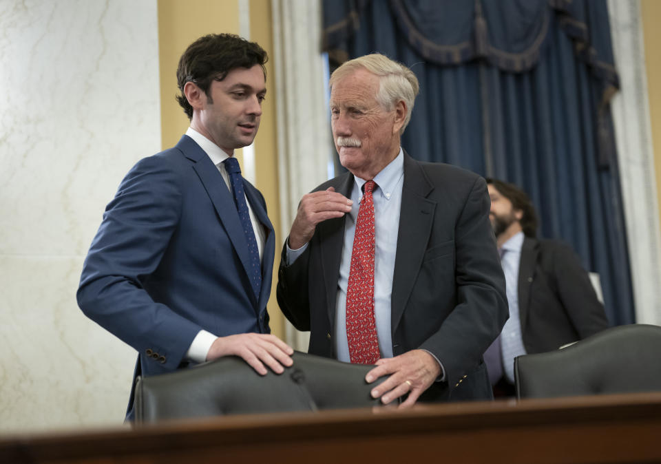 Sen. Jon Ossoff, D-Ga., left, confers with Sen. Angus King, I-Maine, as Senate Rules Committee meets on the Electoral Count Reform and Presidential Transition Improvement Act, at the Capitol in Washington, Tuesday, Sept. 27, 2022. The bill is a response to the Jan. 6 insurrection and former President Donald Trump's efforts to find a way around the Electoral Count Act, the 19th-century law that, along with the Constitution, governs how states and Congress certify electors and declare presidential election winners. (AP Photo/J. Scott Applewhite)