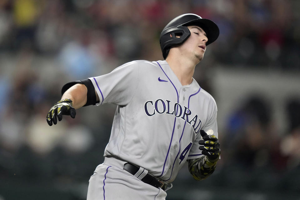 Colorado Rockies' Michael Toglia reacts after committing the final out in the ninth inning of a baseball game against the Texas Rangers in Arlington, Texas, Friday, May 19, 2023. (AP Photo/LM Otero)