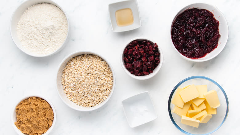 Cranberry oat bar ingredients laid out in bowls