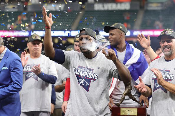 HOUSTON, TEXAS - NOVEMBER 02:  Jorge Soler #12 of the Atlanta Braves celebrates with a cigar following the team's 7-0 victory against the Houston Astros in Game Six to win the 2021 World Series at Minute Maid Park on November 02, 2021 in Houston, Texas. (Photo by Carmen Mandato/Getty Images)