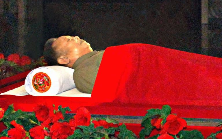 The body of North Korean leader Kim Jong-Il lies in state in a glass coffin at the Kumsusan Memorial Palace in Pyongyang