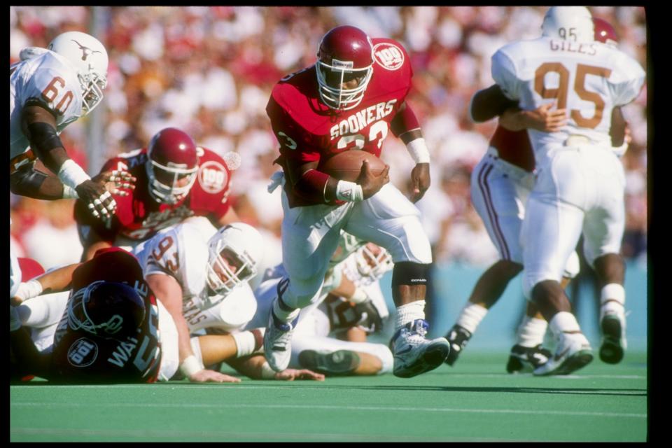 Oct. 13, 1990: Fullback Kenyon Rusheed of the Oklahoma Sooners runs down the field during a game against the Texas Longhorns at the Cotton Bowl in Dallas, <a class="link " href="https://sports.yahoo.com/ncaaf/teams/texas/" data-i13n="sec:content-canvas;subsec:anchor_text;elm:context_link" data-ylk="slk:Texas;sec:content-canvas;subsec:anchor_text;elm:context_link;itc:0">Texas</a>. Texas won the game 14-13. Joe Patronite /Allsport