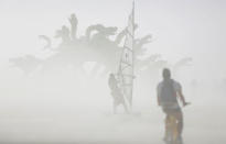 <p>Dust blows past an art installation as approximately 70,000 people from all over the world gather for the 30th annual Burning Man arts and music festival in the Black Rock Desert of Nevada, Aug. 30, 2016. (REUTERS/Jim Urquhart)</p>