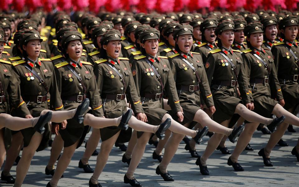 North Korean female soldiers march and shout slogans during a military parade in 2017 - DAMIR SAGOLJ/Reuters