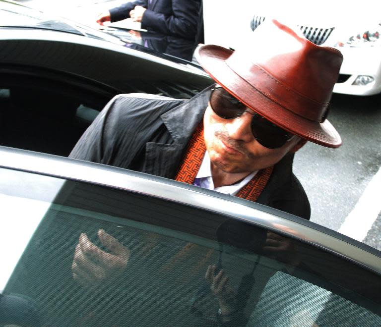 Kenichi Shinoda, boss of Japan's largest yakuza gang, the Yamaguchi-gumi, gets into a car on April 9, 2011 after his release from a Tokyo prison