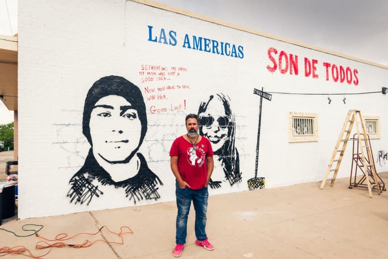 Manuel Oliver stands in front of a mural he is painting in 2019 of his son, Joaquin Oliver, who was killed in the Parkland, Fla., mass shooting. File Photo by Justin Hamel/UPI