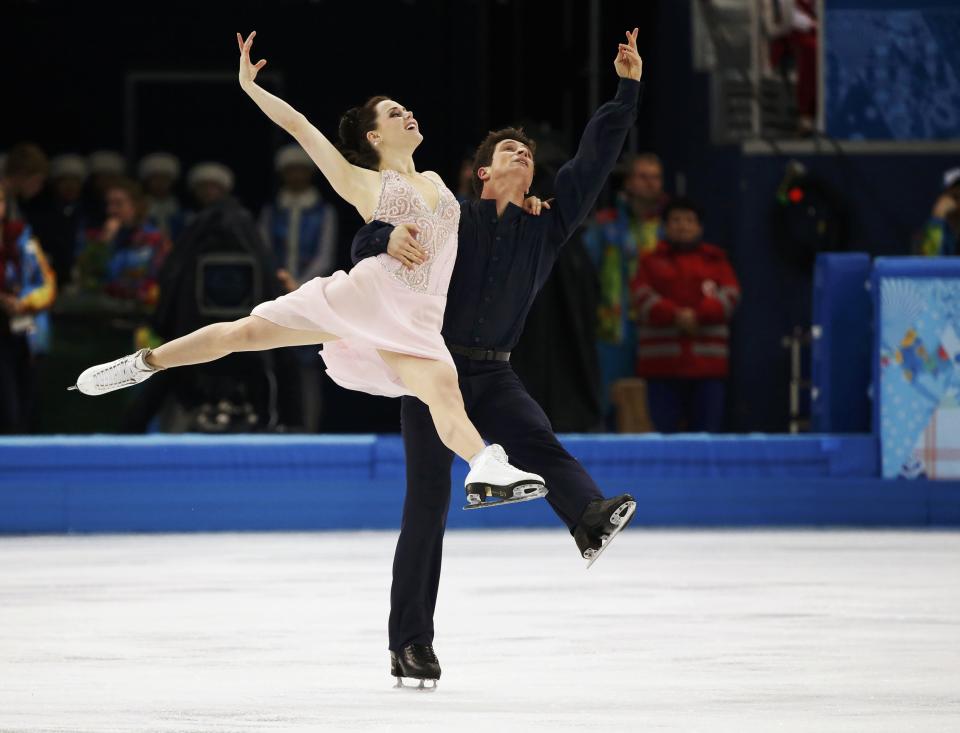 Canada's Tessa Virtue and Scott Moir compete during the Figure Skating Ice Dance Free Dance Program at the Sochi 2014 Winter Olympics, February 17, 2014. (REUTERS/Lucy Nicholson)