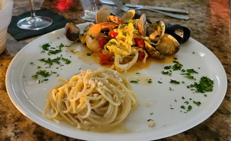 Two pastas split to share at Casa Cotzelli: spaghetti burro alici ($18) and linguini frutti di mare ($37).