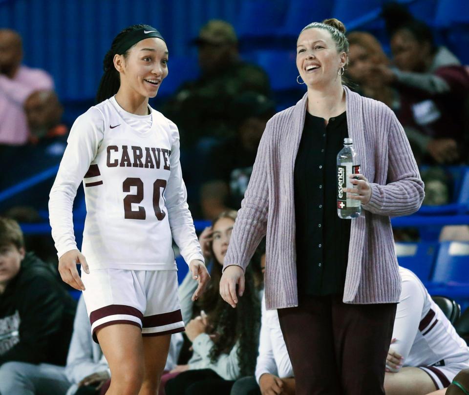 Caravel's India Johnston (left) and head coach Kristin Caldwell have a relaxed moment in the second half of Caravel's 54-36 win against Tatnall in a DIAA state tournament seminal at the Bob Carpenter Center, Wednesday, March 9, 2022.