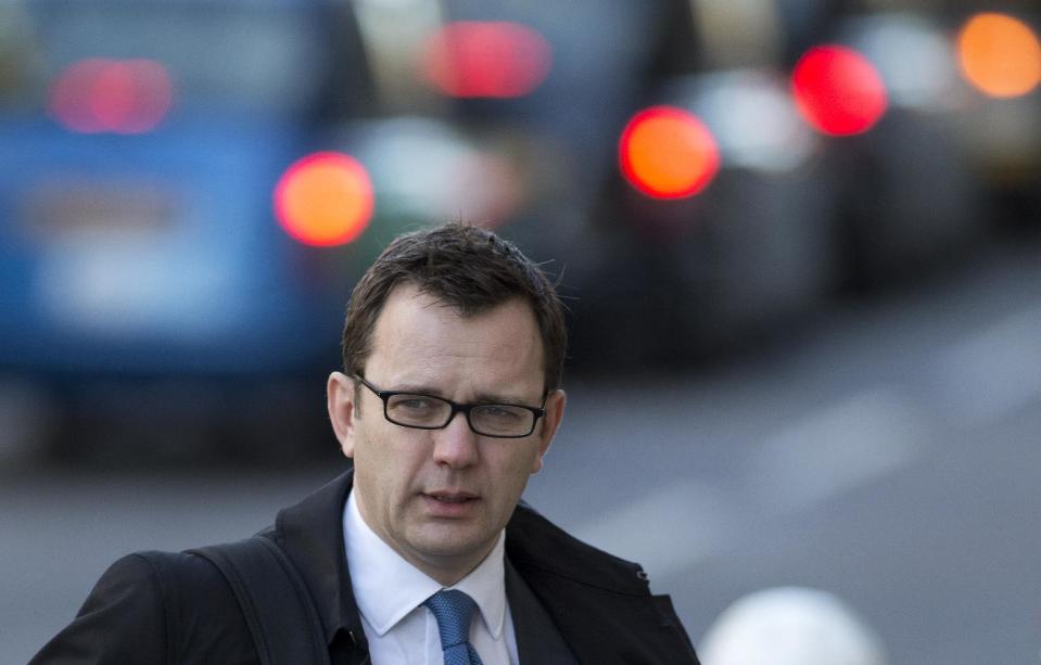 Andy Coulson, former News of the World editor and former aide to British Prime Minister David Cameron arrives at the Central Criminal Court in London where she appears to face charges related to phone hacking Friday, Feb. 21, 2014. (AP Photo/Alastair Grant)