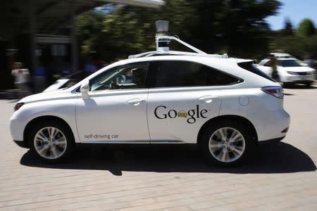 A Google self-driving vehicle drives around the parking lot at the Computer History Museum in Mountain View, California, in this file photo taken May 13, 2014. REUTERS/Stephen Lam/Files