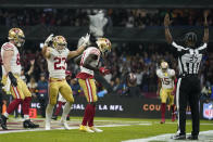 San Francisco 49ers wide receiver Brandon Aiyuk, center, celebrates his touchdown during the first half of an NFL football game against the Arizona Cardinals, Monday, Nov. 21, 2022, in Mexico City. (AP Photo/Marcio Jose Sanchez)