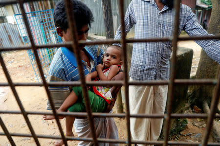 A child suffering from severe diarrhoea is brought to a dysentery clinic run by Medical Teams International in Kutupalong camp near Cox's Bazar, Bangladesh October 7, 2017. REUTERS/Damir Sagolj