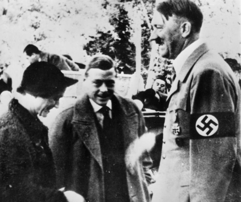 The couple meeting Adolf Hitler in Germany in 1937.