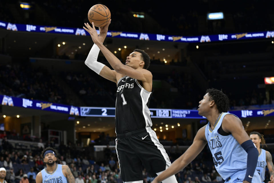 San Antonio Spurs center Victor Wembanyama (1) shoots ahead of Memphis Grizzlies forward GG Jackson (45) in the first half of an NBA basketball game Tuesday, April 9, 2024, in Memphis, Tenn. (AP Photo/Brandon Dill)