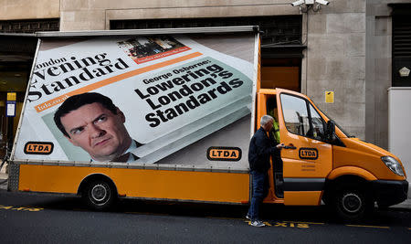 A van displaying a poster of a mock edition of the Evening Standard is seen outside the Evening Standard offices in London, Britain, May 2, 2017. REUTERS/Hannah McKay