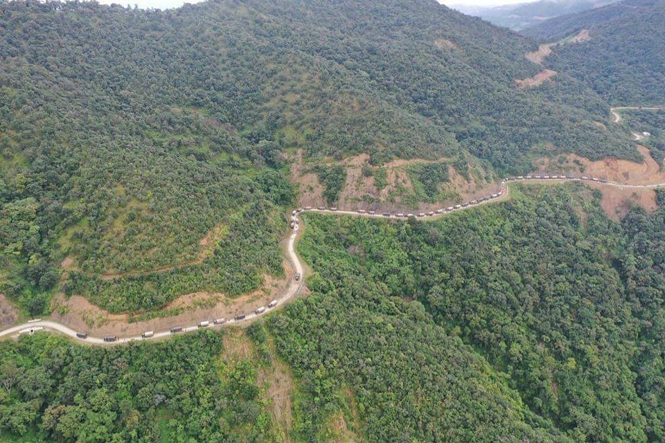 In this Oct. 14, 2021, aerial photo released by the Chin Human Rights Organization, a military convoy approaches Thantlang in Chin State in northwest Myanmar. (Chin Human Rights Organization via AP)