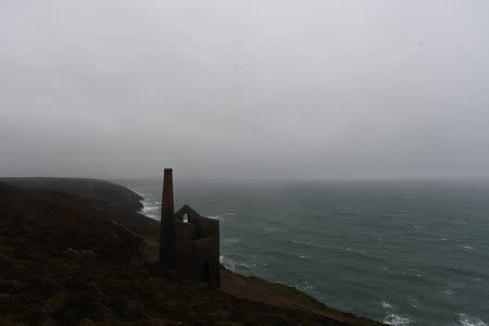 The ruins of Wheal Coates, a former tin mine are silhouetted near the Cornwall town of St. Agnes, Britain March 8, 2019. It closed when the price of tin fell in 1889. REUTERS/Clodagh Kilcoyne/Files