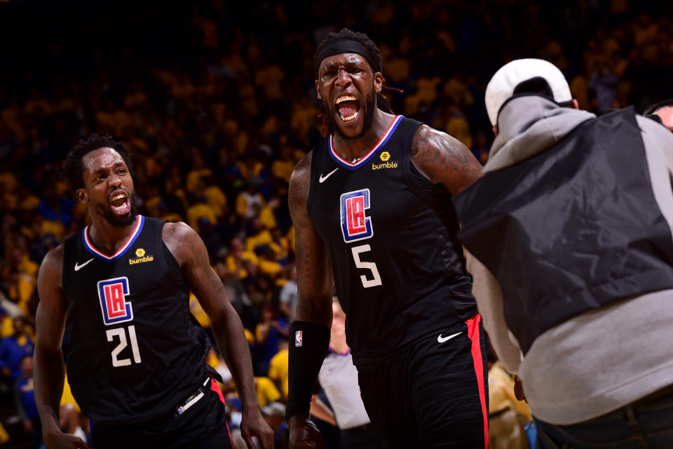 OAKLAND, CA - APRIL 15: Patrick Beverley #21 and Montrezl Harrell #5 of the LA Clippers react during a game against the Golden State Warriors during Game Two of Round One of the 2019 NBA Playoffs on April 15, 2019 at ORACLE Arena in Oakland, California. NOTE TO USER: User expressly acknowledges and agrees that, by downloading and or using this photograph, user is consenting to the terms and conditions of Getty Images License Agreement. Mandatory Copyright Notice: Copyright 2019 NBAE (Photo by Noah Graham/NBAE via Getty Images)