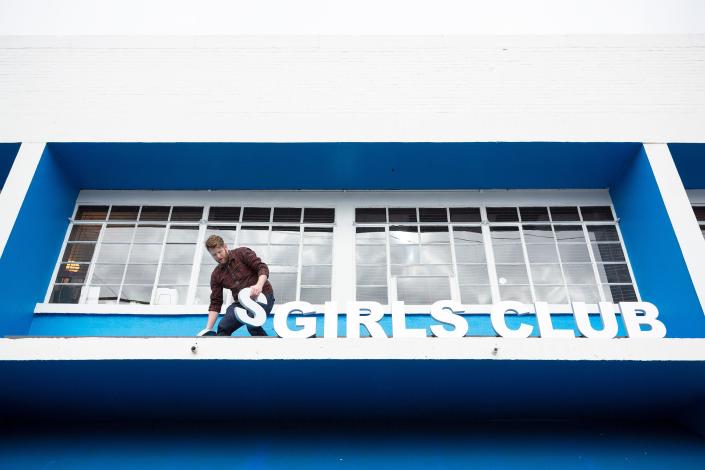 Bryson Leach, owner of Good Sign Design, installs a new sign for the Boys &amp; Girls Clubs of South Central Tennessee at its location in Columbia, Tenn., on Thursday, Jan. 13, 2022.