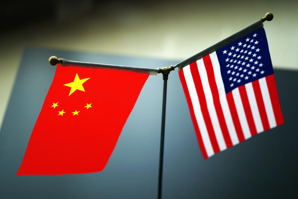 --FILE--National flags of China and the United States are seen in Ji'nan city, east China's Shandong province, 31 May 2019. Even as Chinese and American trade negotiators laid plans to maintain "intensive consultation" this month, President Donald Trump said he will impose 10\% tariffs Sept. 1 on an additional $300 billion a year of imports from China. Trump disclosed the expansion of tariffs Thursday in a tweet in which he also complained that China failed to increase agricultural purchases and to cut off the flow of the opioid drug fentanyl to the U.S. from China as he said President Xi Jinping promised. Trump said the new duties will be in addition to the tariffs of as much as 25\% on $250 billion a year of Chinese imports. The Dow Jones Industrial Average plunged 200 points following the news, erasing a gain of 300 points earlier in the day. China didn't immediately respond to Trump's tweet, which he concluded by writing, "We look forward to continuing our positive dialogue with China." (Photo by Da qing - Imaginechina/Sipa USA)