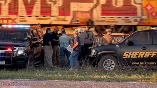 PHOTO: Law enforcement personnel are shown on the scene after two migrants suffocated to death aboard a freight train that got derailed, in Uvalde, Texas, on March 24, 2023, in this screengrab obtained from a social media video. (Joey Palacios via Reuters)