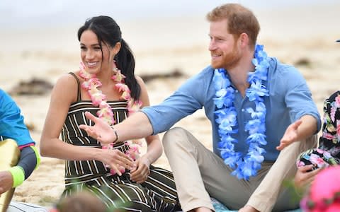 Prince Harry and Meghan, Duchess of Sussex on Bondi Beach during their visit to Sydney on the fourth day of the royal couple's visit to Australia - Credit: Dominic Lipinski/Reuters