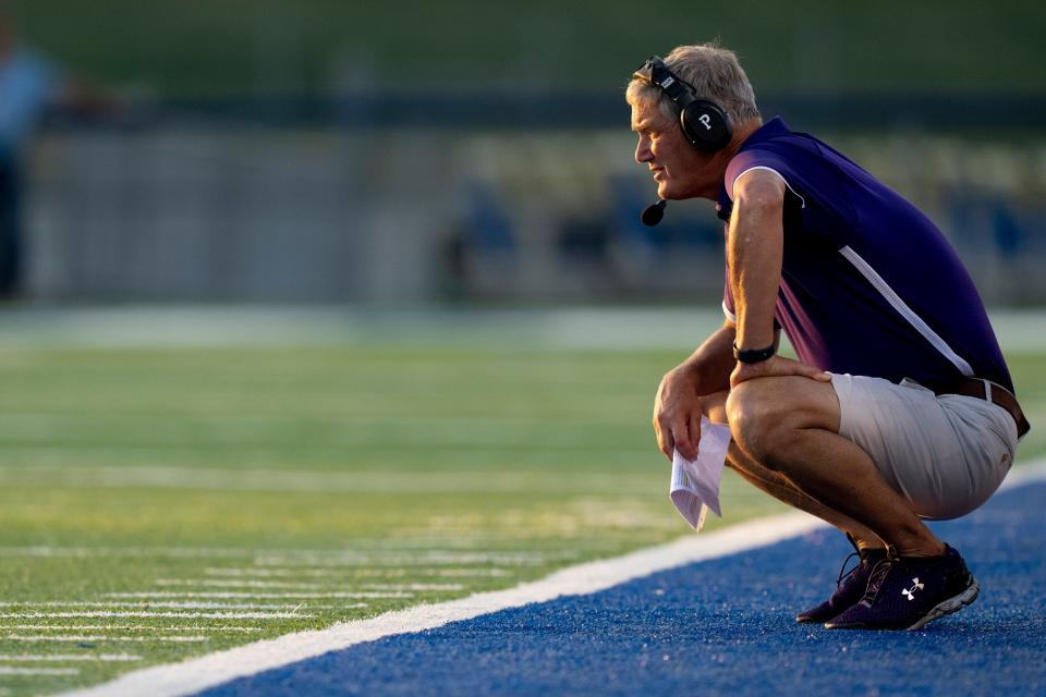 Elder head coach Doug Ramsey looks on during the first half of the OHSAA football game between Xavier High School and Elder High School at RDI Stadium in Finneytown on Friday, Sept. 22, 2023.