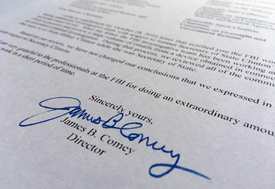 FILE - Part of a Nov. 6, 2016, letter from FBI Director James Comey to Congress is photographed in Washington on Nov. 6, 2016. Comey told Congress that a review of new Hillary Clinton emails has "not changed our conclusions" from earlier this year that she should not face charges. (AP Photo/Jon Elswick, File)