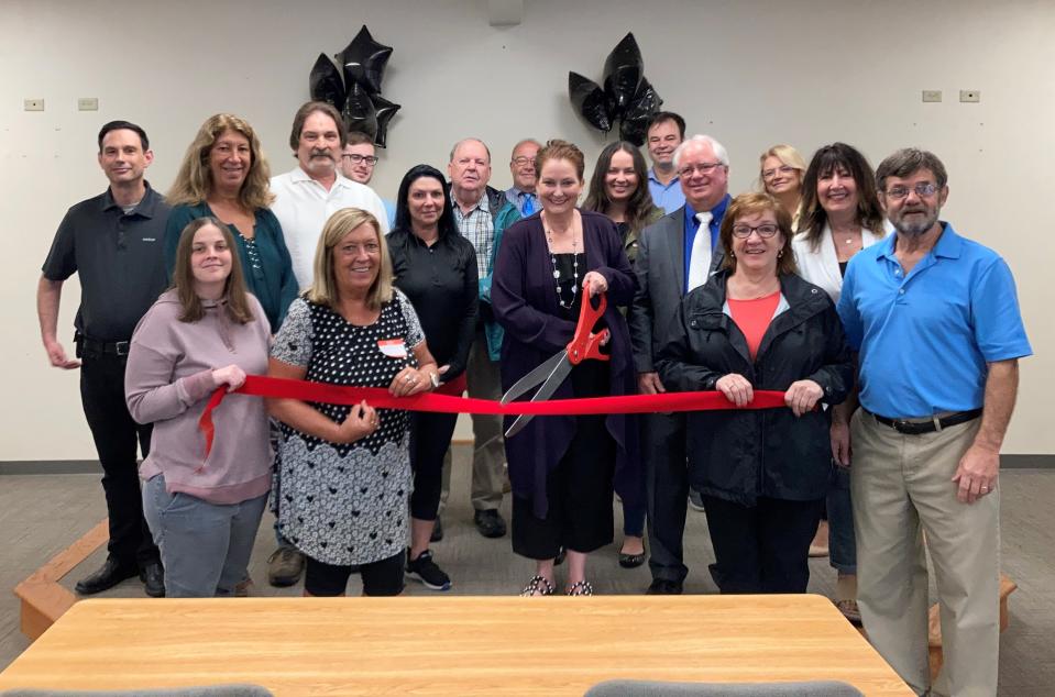 Pictured cutting the ribbon is owner Jennifer Marachese along with the Sanford Springvale Chamber Ambassador Committee and Allied Career Training facility.