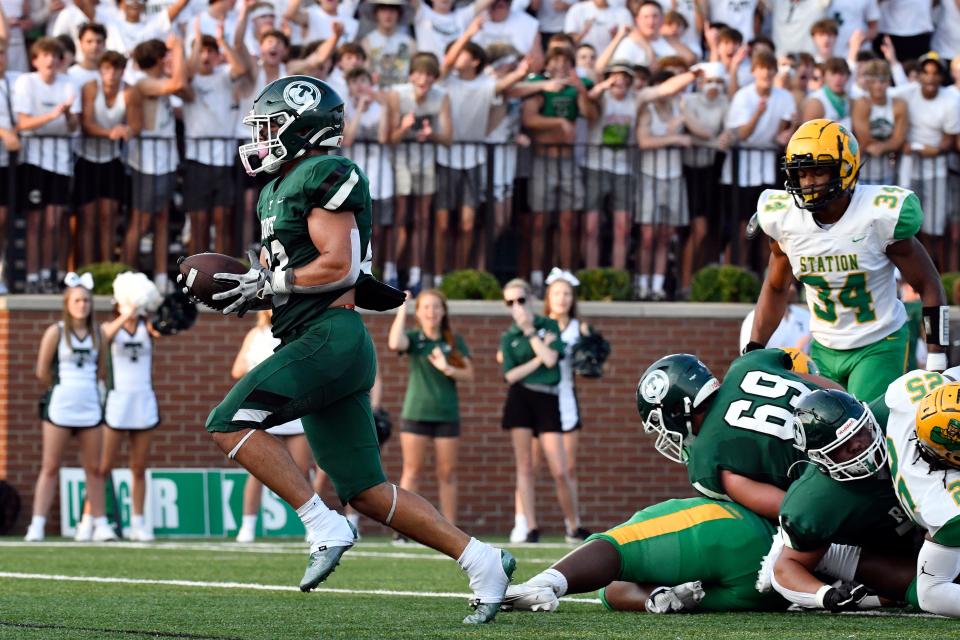 Trinity running back Clint Sansbury (23) crosses the goal line to score the first Trinity touchdown of the season during the first half of their game against Bryan Station, Friday, Aug. 18 2023 in Louisville Ky.