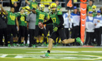 Linebacker Kiko Alonso #47 of the Oregon Ducks picks up a fumble during the third quarter of the game on October 6, 2012 at Autzen Stadium in Eugene, Oregon. Oregon won the game 52-21. (Photo by Steve Dykes/Getty Images)